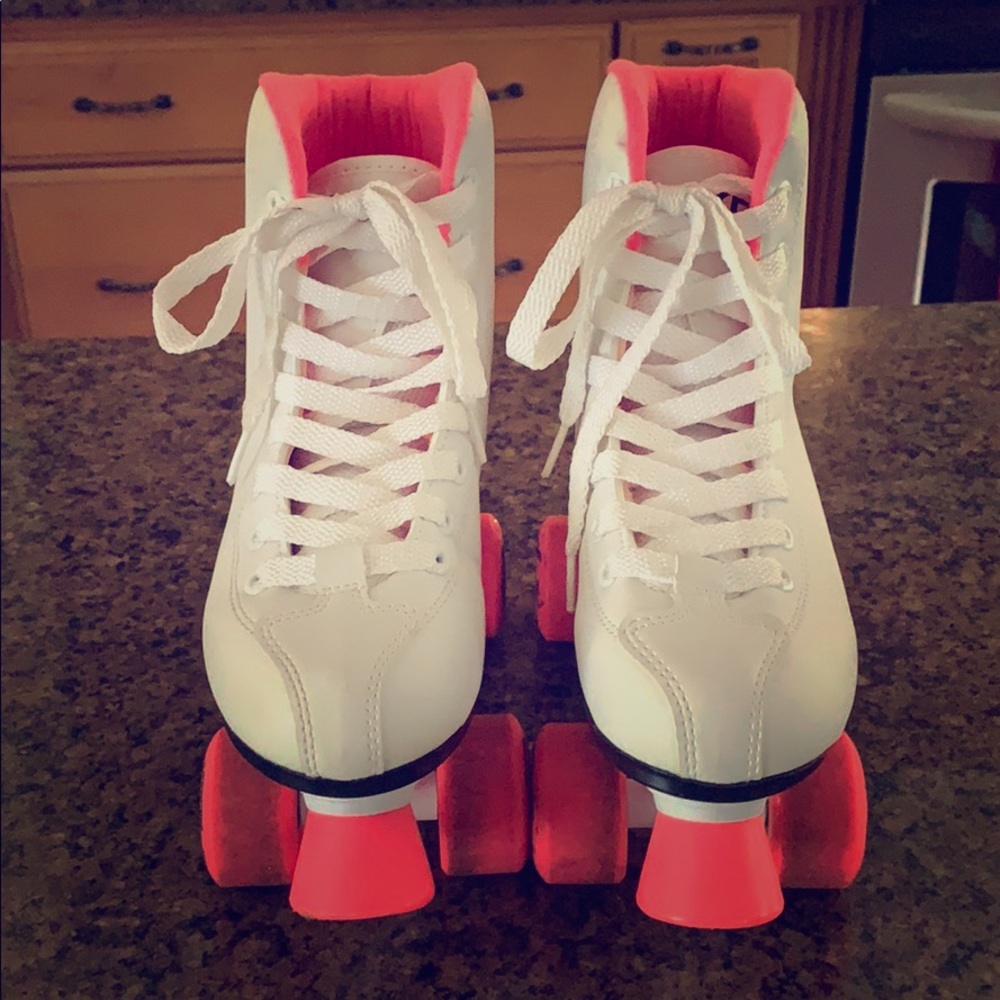 Pink and white roller skates